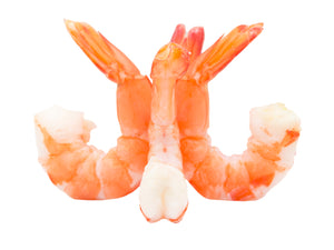 Plump, white shrimp with head shells removed. The cooked Tiger Shrimp have a beautiful orange speckling when removed from their red shell.